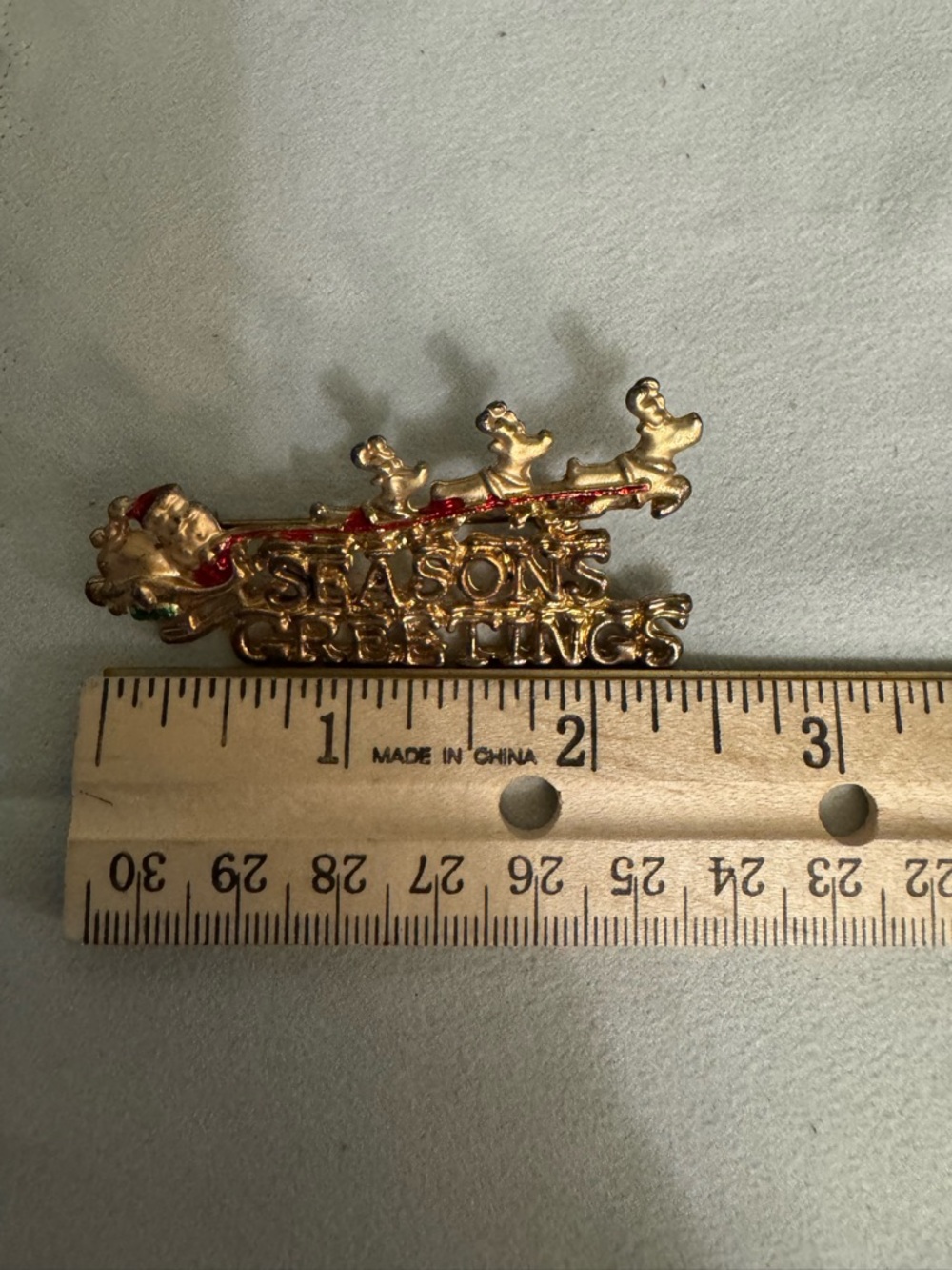 Season's Greetings Gold-tone Santa Sleigh Pin with Red & Green Accents